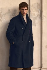 Shop by Look 05 Edition Vol. 19: front view of model wearing a black double-breasted Agnona cashmere coat with large buttons and wide collar, and a sand melange Aida Barni cashmere turtleneck sweater, creating a sophisticated, elegant cold-weather look.