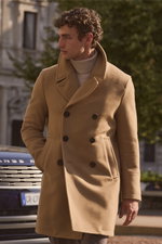 Shop by Look 07 Edition Vol. 19 shows a left side view of a model wearing Sealup's camel Genova pea coat, double-breasted with dark buttons, over Aida Barni's sand melange cashmere turtleneck sweater.