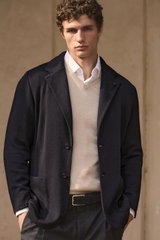 Shop by Look 09 Edition Vol. 19: front view of model wearing navy knit blazer by Lardini, sand cashmere V-neck jumper by Aida Barni, white Borrelli shirt, navy checkered Berwich pants, and black belt with silver buckle.