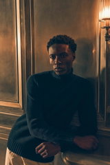 Shop by Look 22 Edition Vol. 19, model photographed from the front wearing a navy cashmere FTC turtleneck with ribbed collar, cuffs, hem, paired with white PT Torino 'The Rebel' pants, elegant and sophisticated blend of luxurious materials and classic col