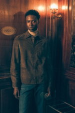Front view of model in brown suede jacket, beige melange cashmere turtleneck, and grey-blue jeans by Brunello Cucinelli in Shop by Look 24 Edition Vol. 19.