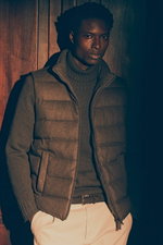 Shop by Look 27 Edition Vol. 19 shows a front view of a model in a brown melange down vest from Herno, dark brown cashmere turtleneck from FTC, cream 'Ben' chinos by Dondup, and dark brown braided belt from Officine Creative, blending rich browns with lig