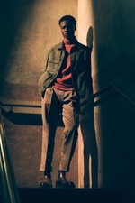 Shop by Look 28 Edition Vol. 19 shows a model from low front wearing a dark green velour leather 'Mex' jacket by Arma, rust brown turtleneck by Filippo de Laurentiis, taupe 'Chiaia' chinos from Berwich, and brown 'Dude Flexi' Chelsea boots from Officine C