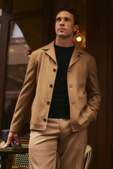 Shop by Look 02 Denis Cebulec in Lardini for BRAUN Hamburg: model from mid-front wears camel-colored Accony overshirt, black B.F. Knitwear sweater, light brown trousers, refined warm style.